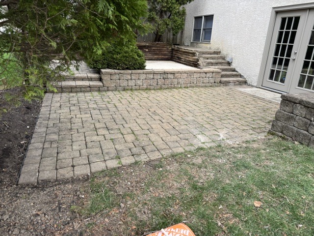 Before: a paver patio in the Columbus area dulled by ground-in dirt, algae, and weathered joints